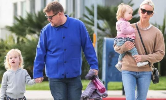 Charlotte Corden (holding by her mother) with her parents and sister, Carley